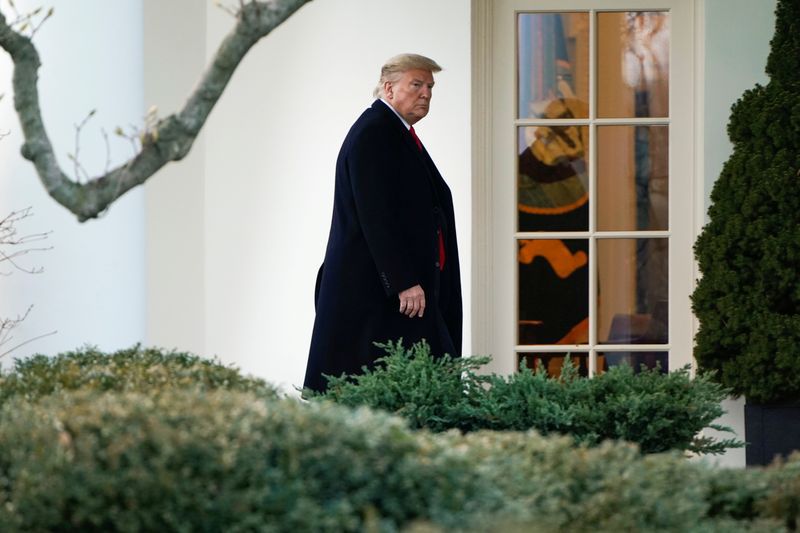 FILE PHOTO: U.S. President Donald Trump walks to the Oval Office as he returns from a day trip from North Carolina at the White House in Washington, U.S., February 7, 2020. REUTERS/Joshua Roberts/File Photo