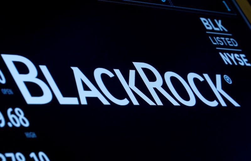FILE PHOTO: The company logo and trading information for BlackRock is displayed on a screen on the floor of the New York Stock Exchange (NYSE) in New York, U.S., March 30, 2017. REUTERS/Brendan McDermid//File Photo