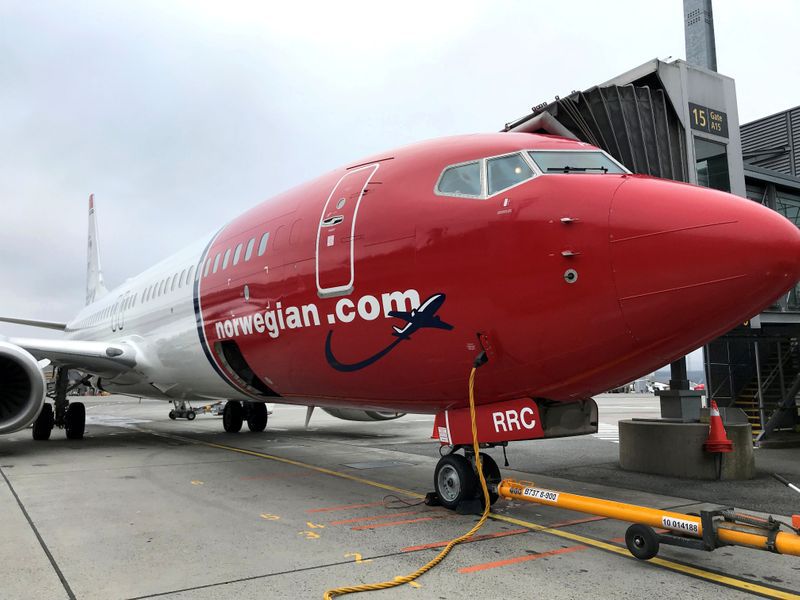 FILE PHOTO: A Norwegian Air plane is refuelled at Oslo Gardermoen airport, Norway November 7, 2019. REUTERS/Lefteris Karagiannopoulos/File Photo