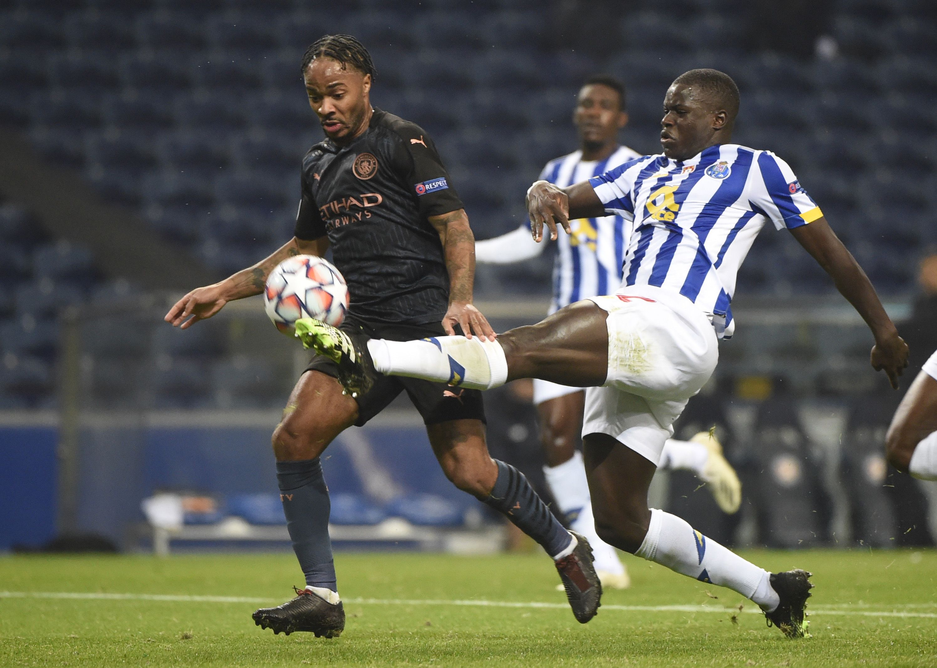 Soccer Football - Champions League - Group C - FC Porto v Manchester City - Estadio do Dragao, Porto, Portugal - December 1, 2020 Manchester City's Raheem Sterling in action with FC Porto's Malang Sarr Pool via REUTERS/Miguel Riopa