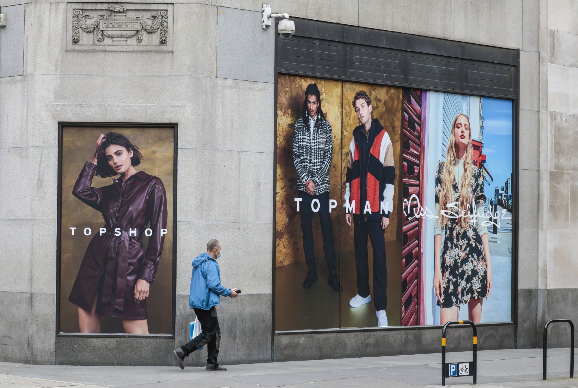 A pedestrian passes the Topshop flagship store, operated by Arcadia Group Ltd., on Oxford Street in central London, U.K., on Monday, Nov. 30, 2020. Philip Green's Arcadia Group is poised to seek protection from creditors and become the most notable U.K. retail insolvency since the beginning of the coronavirus pandemic. Photographer: Jason Alden/Bloomberg