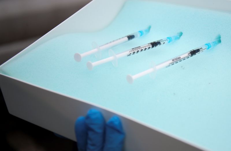FILE PHOTO: Syringes with the COVID-19 vaccine are pictured at a drive through vaccination centre, amid the outbreak of the coronavirus disease (COVID-19), in Hyde, Britain January 7, 2021. REUTERS/Molly Darlington