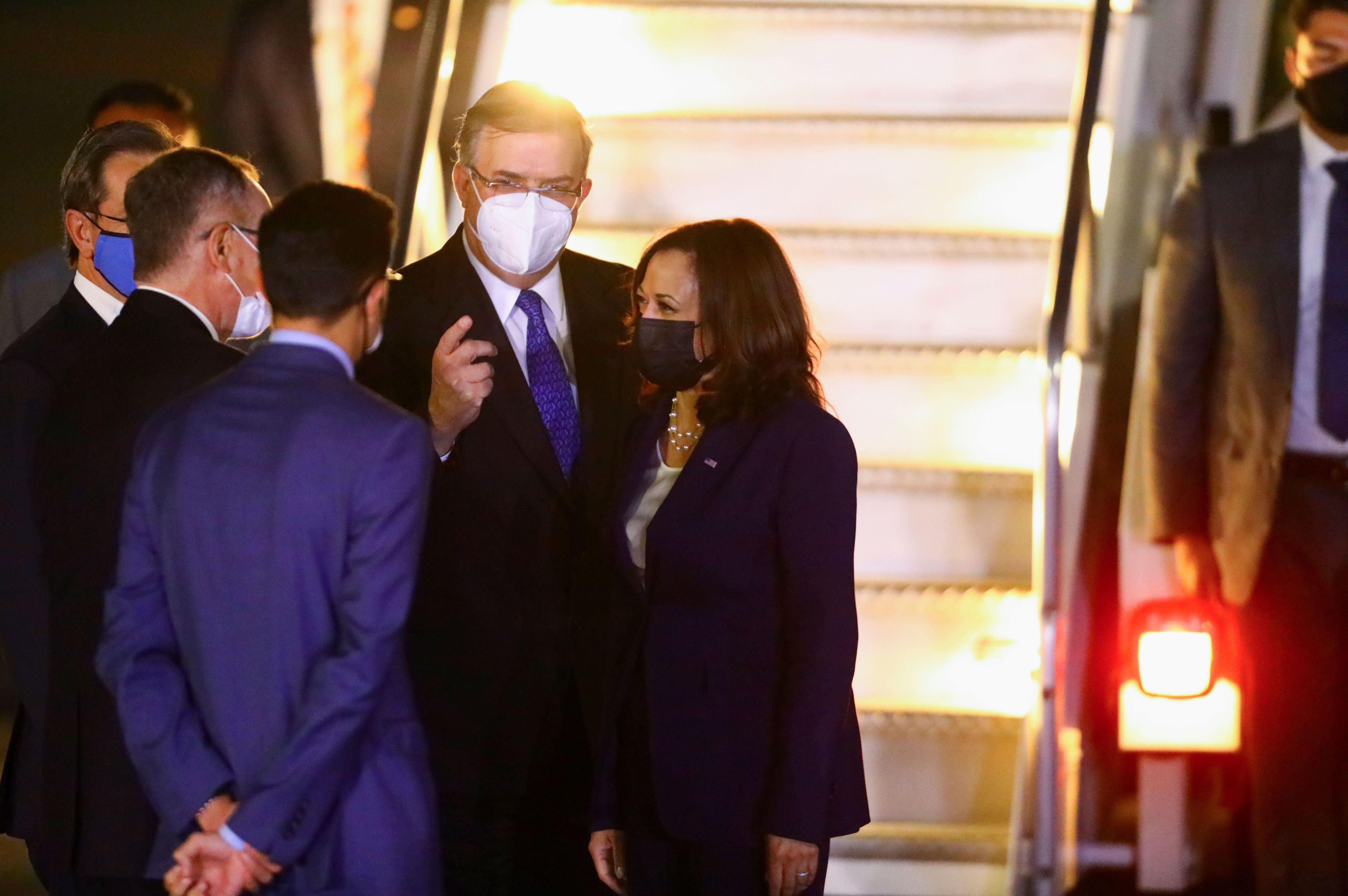 U.S. Vice President Kamala Harris is greeted by Mexican Foreign Minister Marcelo Ebrard as she steps off the plane upon arrival at Benito Juarez International airport in Mexico City, for her first international trip as Vice President to Guatemala and Mexico, in Mexico June 7, 2021. REUTERS/Edgard Garrido