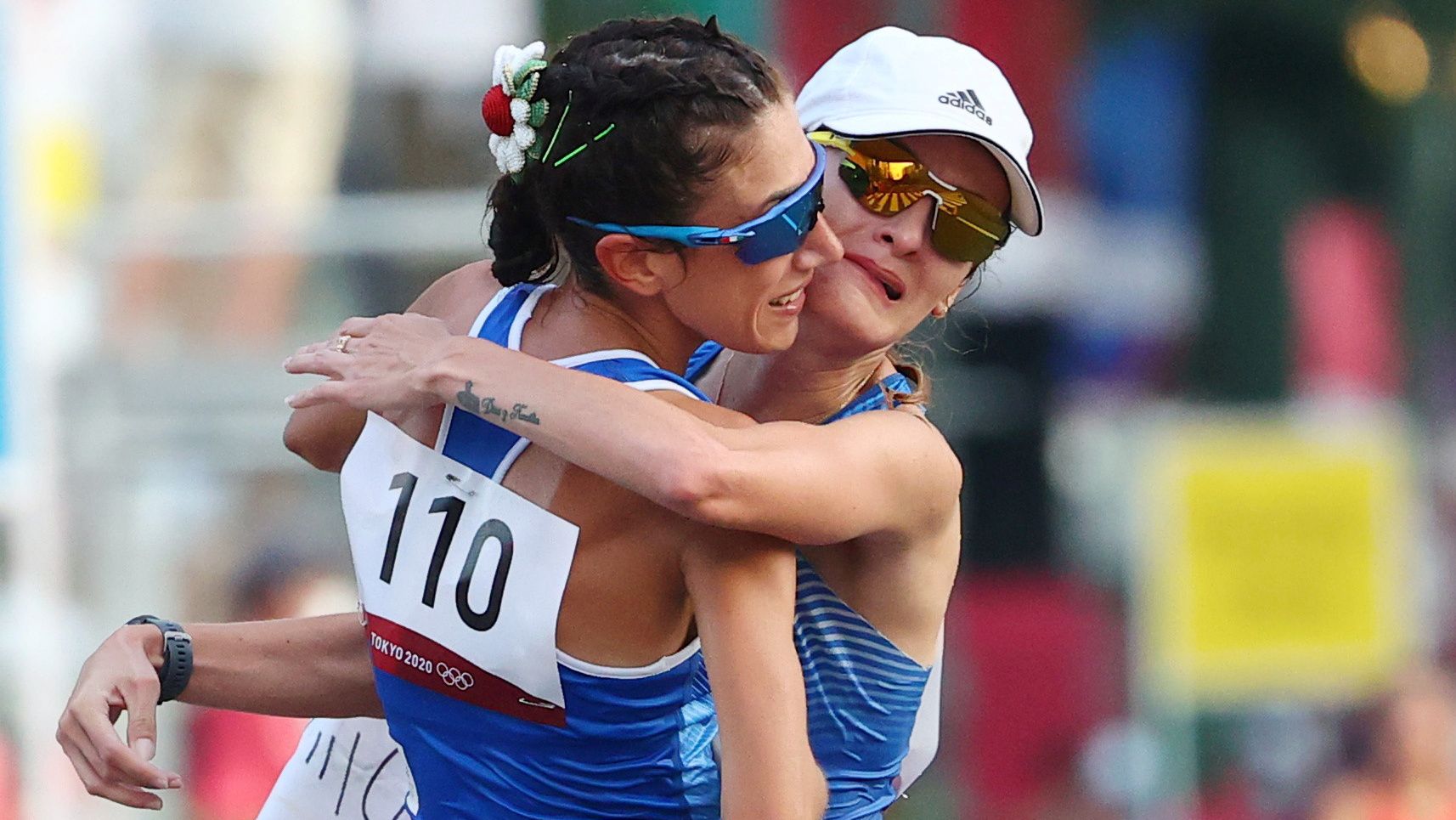 Tokyo 2020 Olympics - Athletics - Women's 20km Walk - Sapporo Odori Park, Sapporo, Japan - August 6, 2021. Gold medallist, Antonella Palmisano of Italy celebrates with silver medallist, Sandra Arenas of Colombia after the race REUTERS/Feline Lim