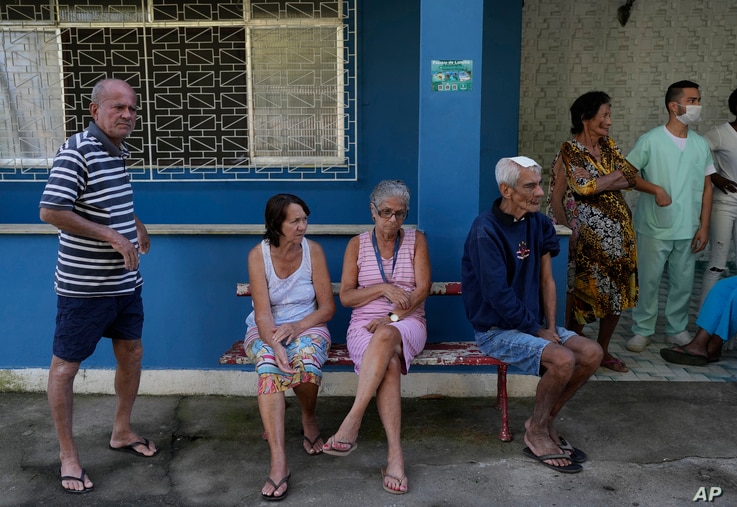 Elderly residents wait for a dose of the Pfizer COVID-19 vaccine, during a third dose campaign for the elderly in long-term…