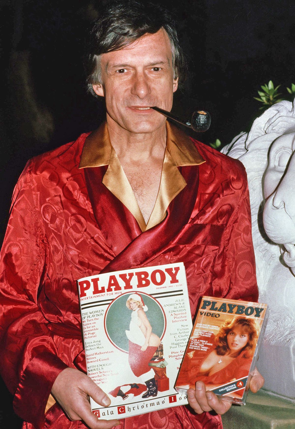 Mandatory Credit: Photo by Nick Ut/AP/REX/Shutterstock (6555506a)
Playboy founder Hugh Hefner shown with a Playboy Magazine and Playboy video
Hugh Hefner, USA