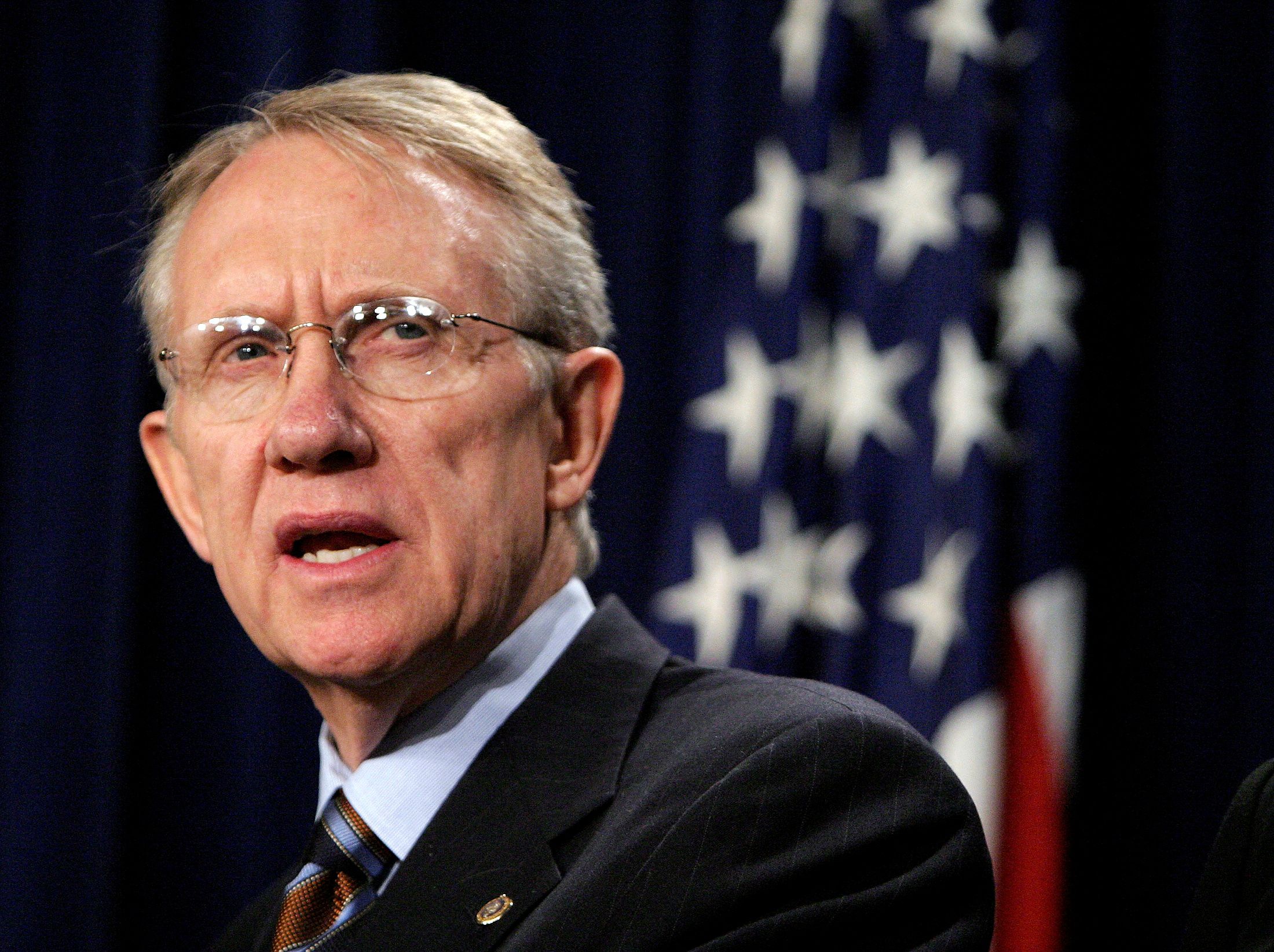FILE PHOTO: Newly elected Senate Minority Leader Harry Reid (D-NV), speaks during a news conference held at the Senate Radio and TV Gallery at the U.S Capitol in Washington November 16, 2004. REUTERS/Shaun Heasley SH/JRB/File Photo