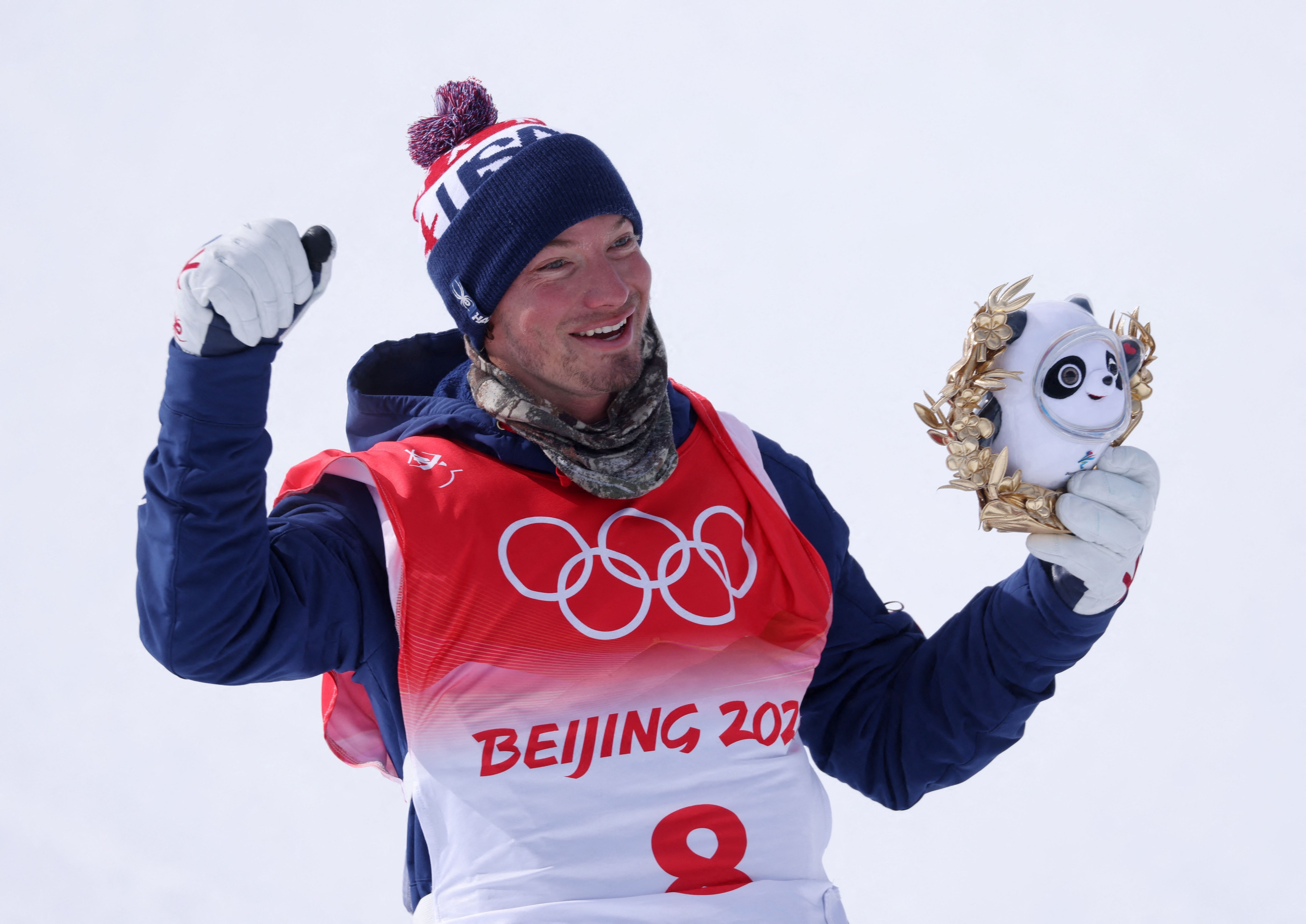 2022 Beijing Olympics - Freestyle Skiing - Men's Freeski - Halfpipe - Final - Run 3 - Genting Snow Park, Zhangjiakou, China - February 19, 2022. Silver medallist David Wise of the United States celebrates during the flower ceremony. REUTERS/Mike Blake