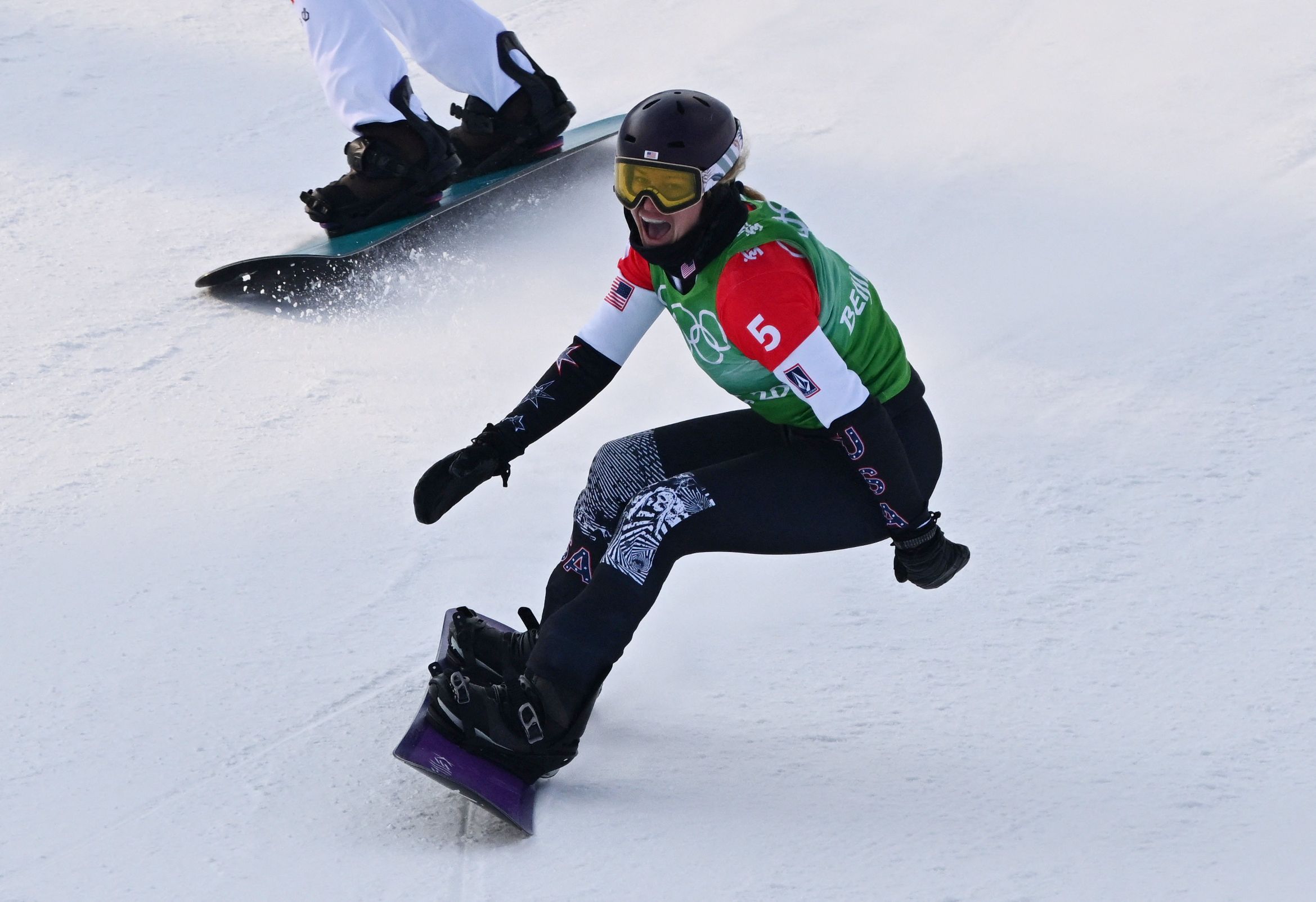 2022 Beijing Olympics - Snowboard - Women's Snowboard Cross Big Final - Genting Snow Park, Zhangjiakou, China - February 9, 2022. Lindsey Jacobellis of the United States celebrates after winning gold. REUTERS/Dylan Martinez