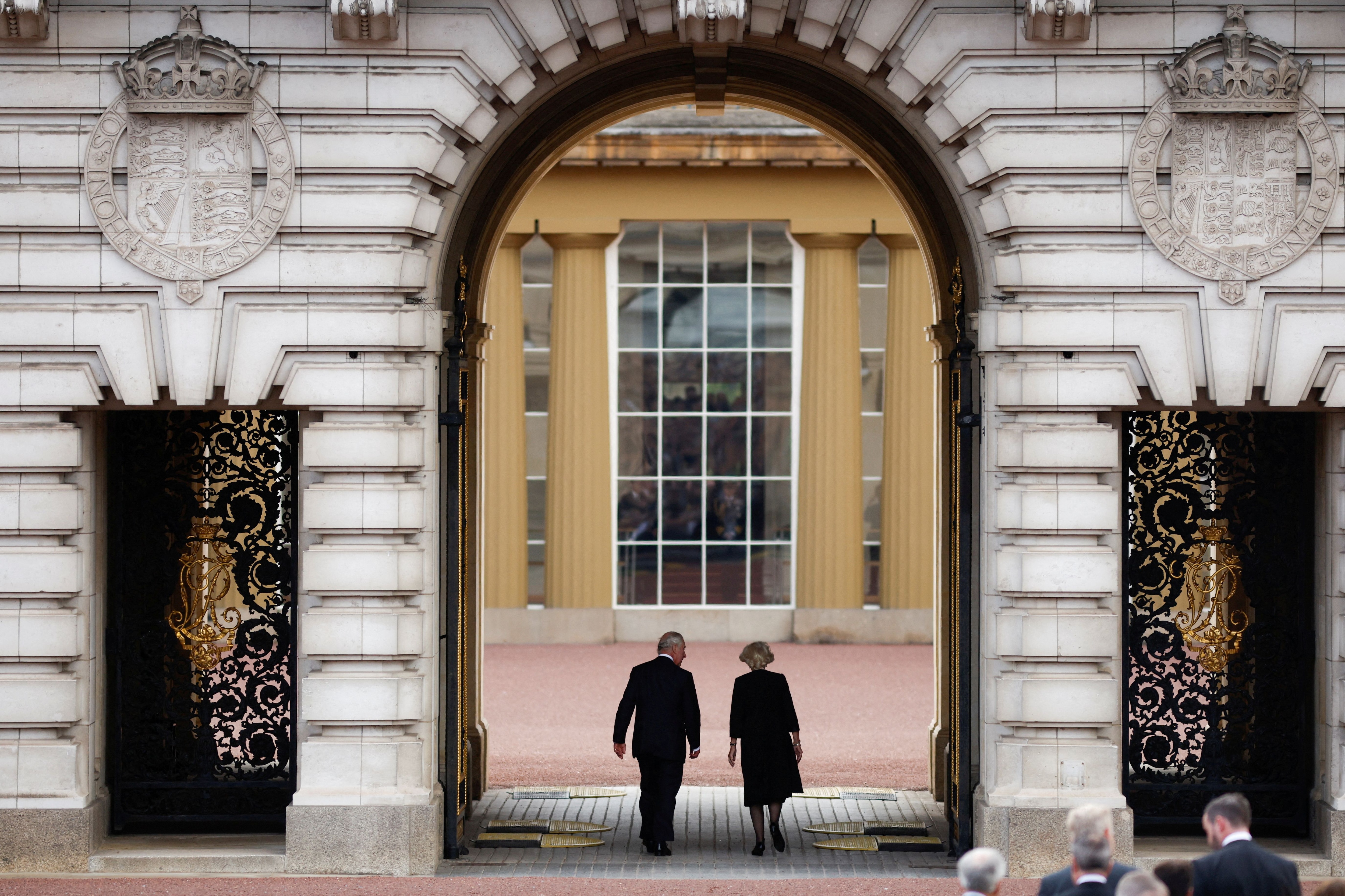 Britain's King Charles and Queen Camilla walk into Buckingham Palace, following the passing of Queen Elizabeth, in London, Britain, September 9, 2022. REUTERS/John Sibley TPX IMAGES OF THE DAY