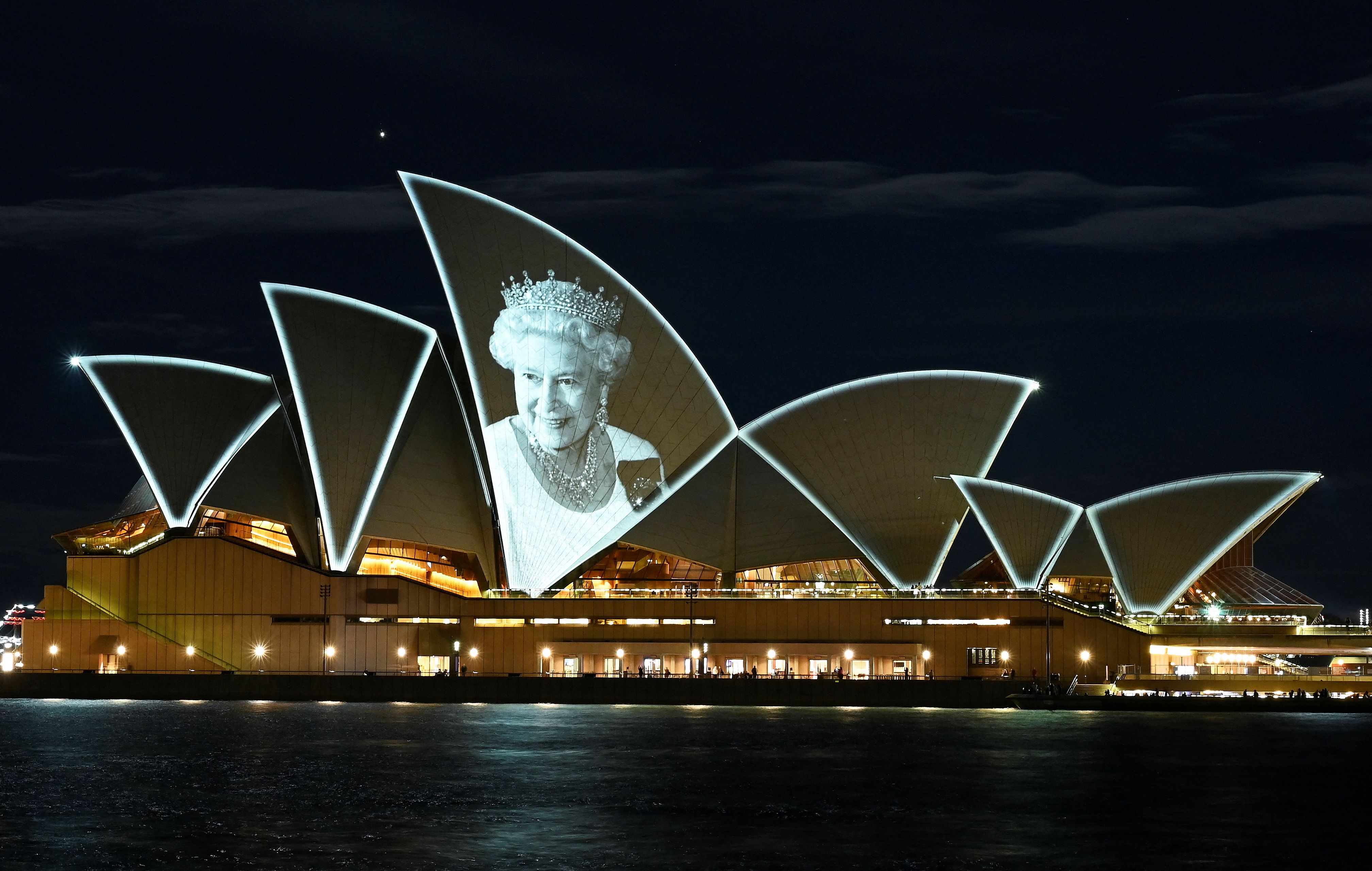 An image of Britain's Queen Elizabeth is illuminated on the sail of Sydney Opera House, following the Queen's passing, in Sydney, Australia, September 9, 2022. REUTERS/Jaimi Joy