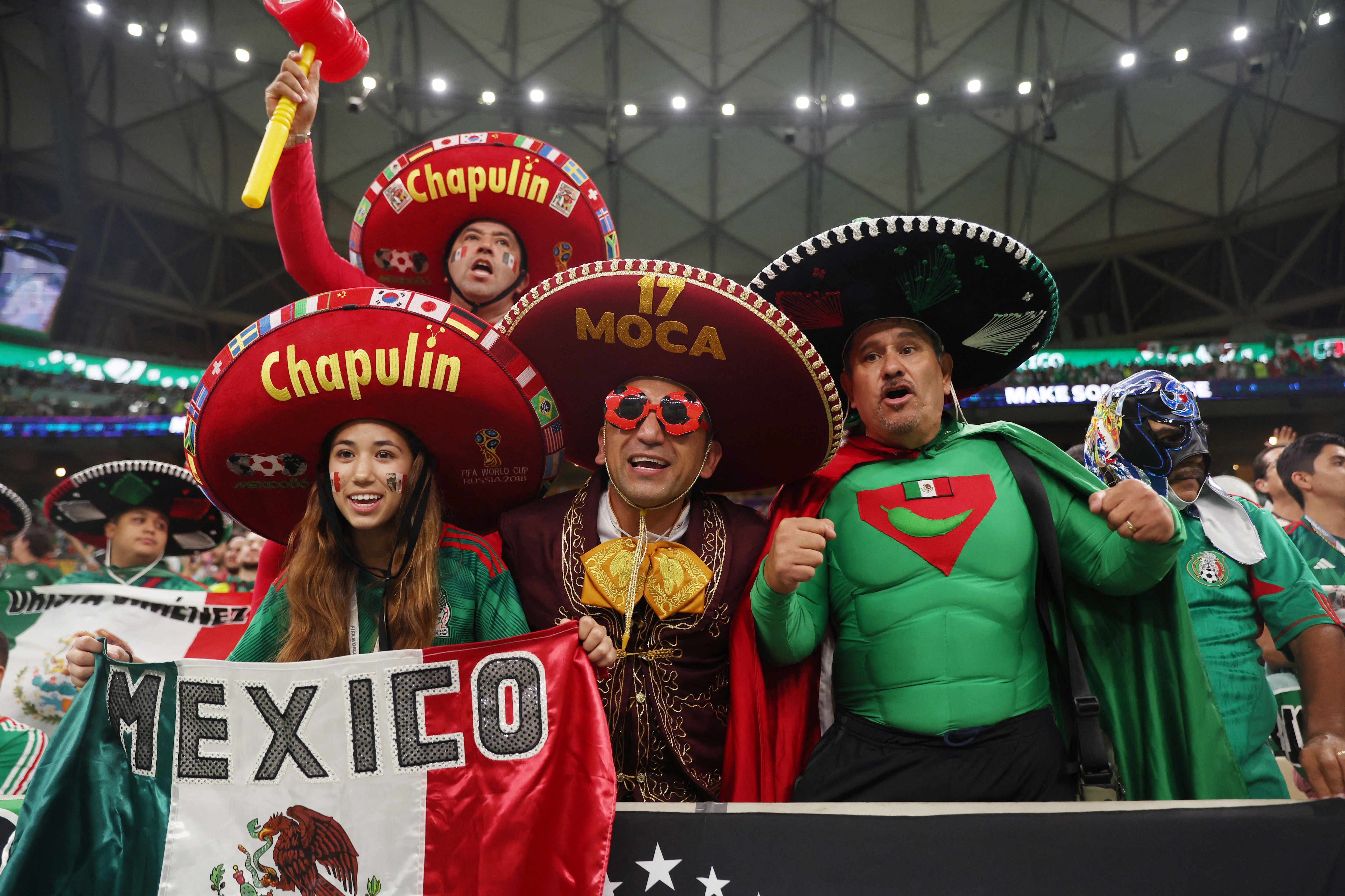 Soccer Football - FIFA World Cup Qatar 2022 - Group C - Argentina v Mexico - Lusail Stadium, Lusail, Qatar - November 26, 2022 Mexico fans wearing fancy dresses inside the stadium before the match REUTERS/Matthew Childs