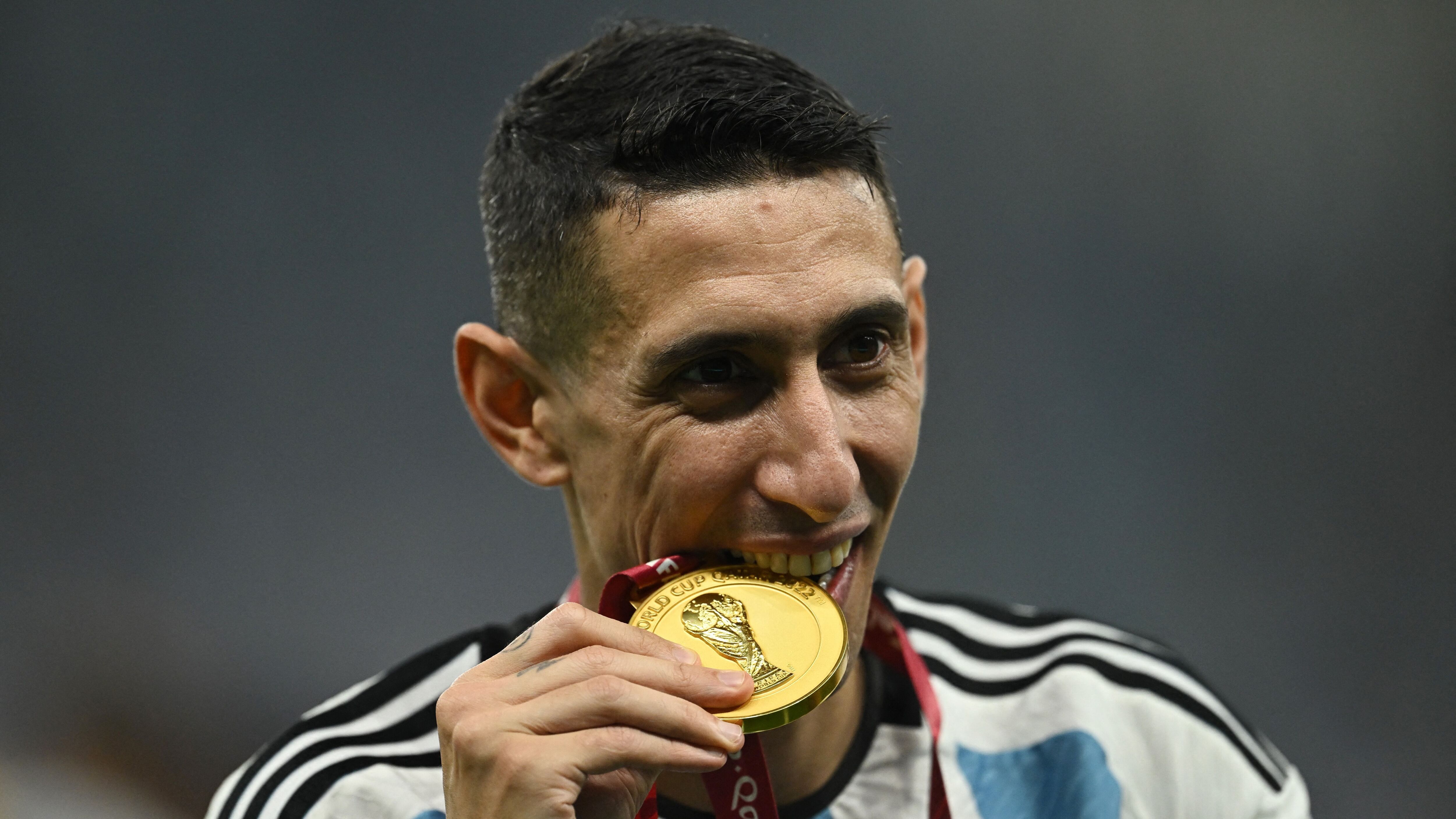 Soccer Football - FIFA World Cup Qatar 2022 - Final - Argentina v France - Lusail Stadium, Lusail, Qatar - December 18, 2022 Argentina's Angel Di Maria celebrates with a medal after winning the World Cup REUTERS/Dylan Martinez